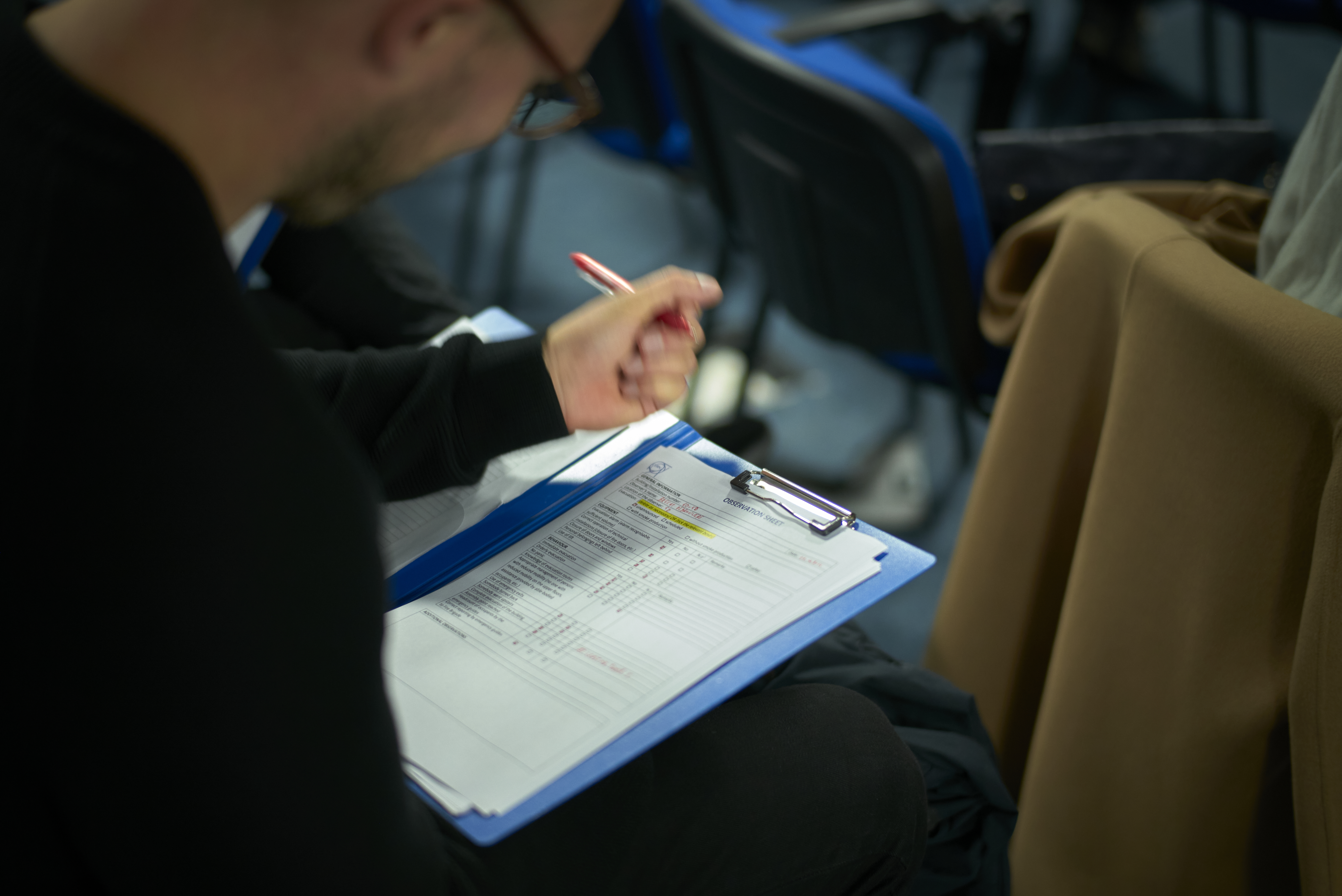 Volunteers fill in their feedback forms.